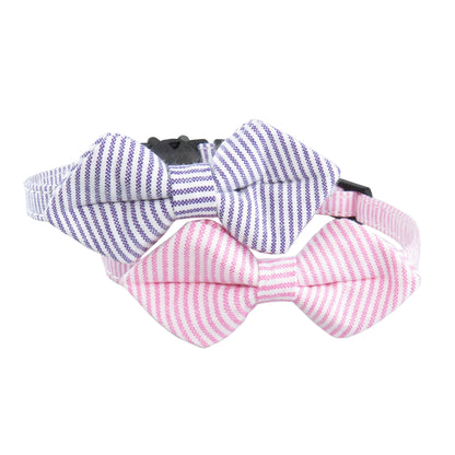 Mokka adjustable cat collar featuring a striped bow tie on white surface