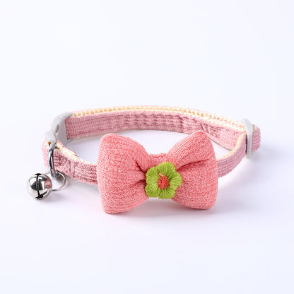 Side view of Mokka adjustable cat collar with bowtie on white background