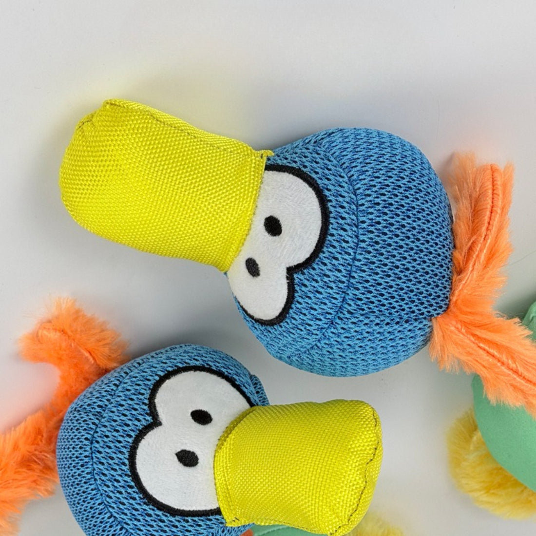 Close-up of Petkin Bird Plush Rope Dog Toy showing soft fabric bird and braided rope