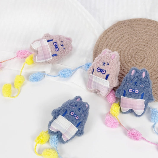 Moo plush cat toy with soft fabric and colorful pom tail on white background