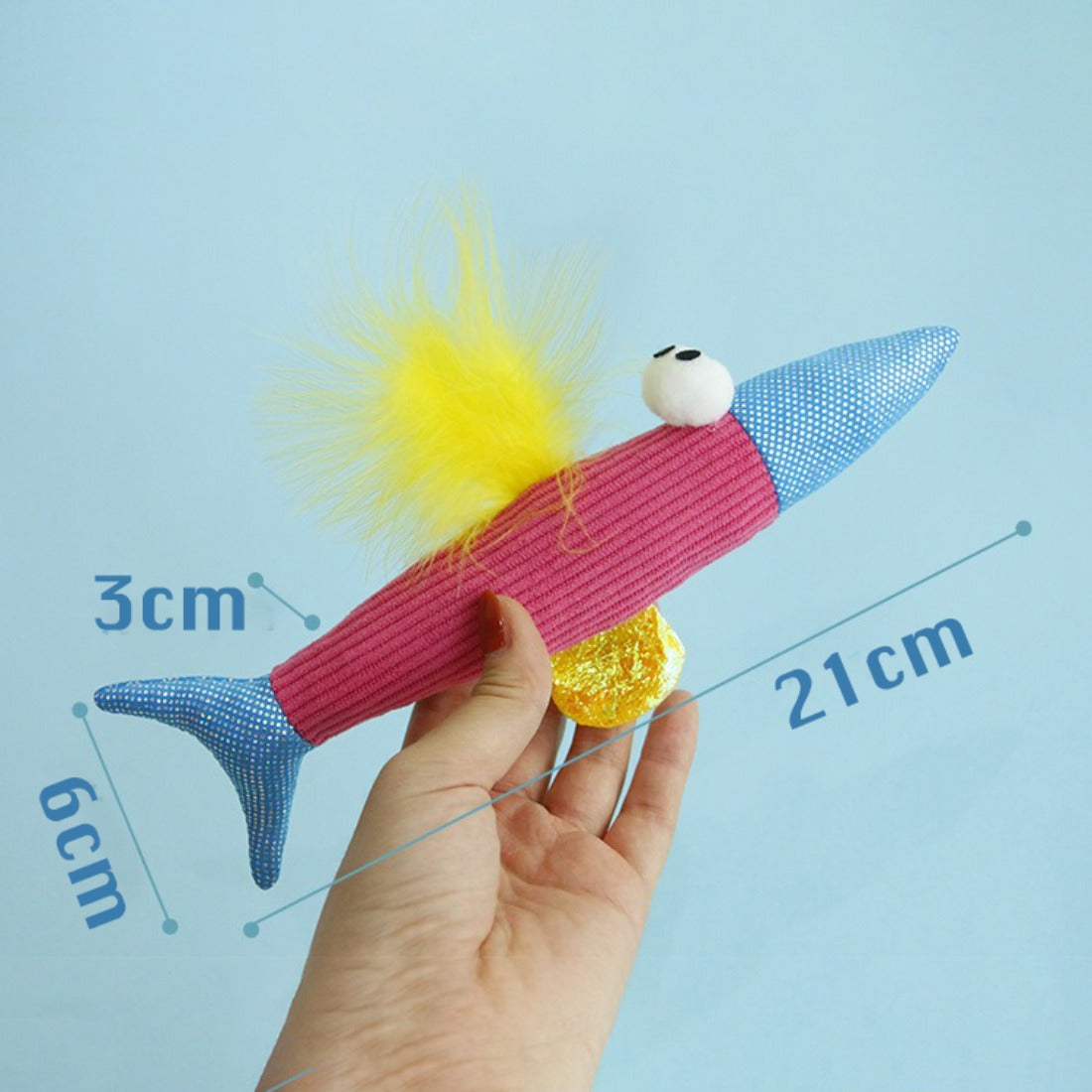 Moo colorful feather fish cat toy isolated on plain background emphasizing feather details