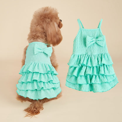 Ozzie summer ruffle dog dress with bow displayed on mannequin against white background