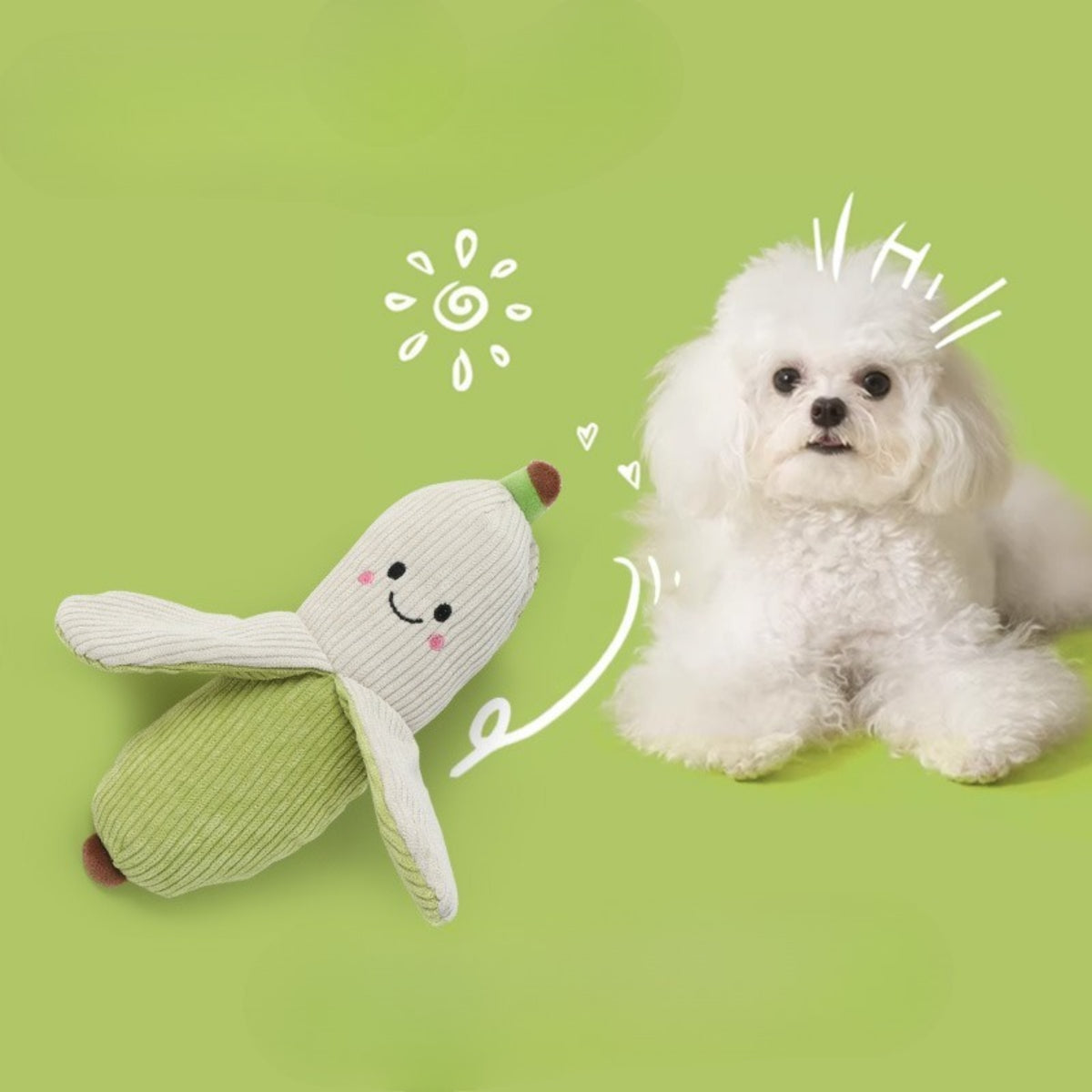 Close-up of Petkin plush carrot dog toy showing soft orange fabric and green leaves