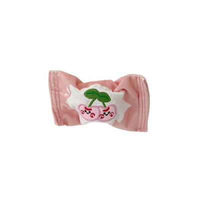 Snuffy Fruit Snack Snuffle Bag with vibrant fruit graphics on fabric surface