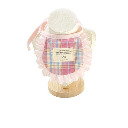 Mokka cat bib folded to show soft fabric and neat stitching on plaid pattern