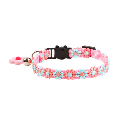 Close-up of Mokka cat collar with rainbow daisy pattern and buckle detail
