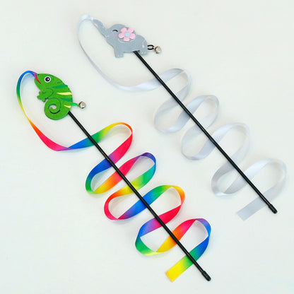 Close-up of colorful ribbons on the wand cat toy showing bright pink, blue, and yellow ribbons