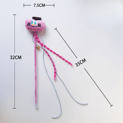 Side view of Moo plush cat teaser wand highlighting plush cat head and feather attachment