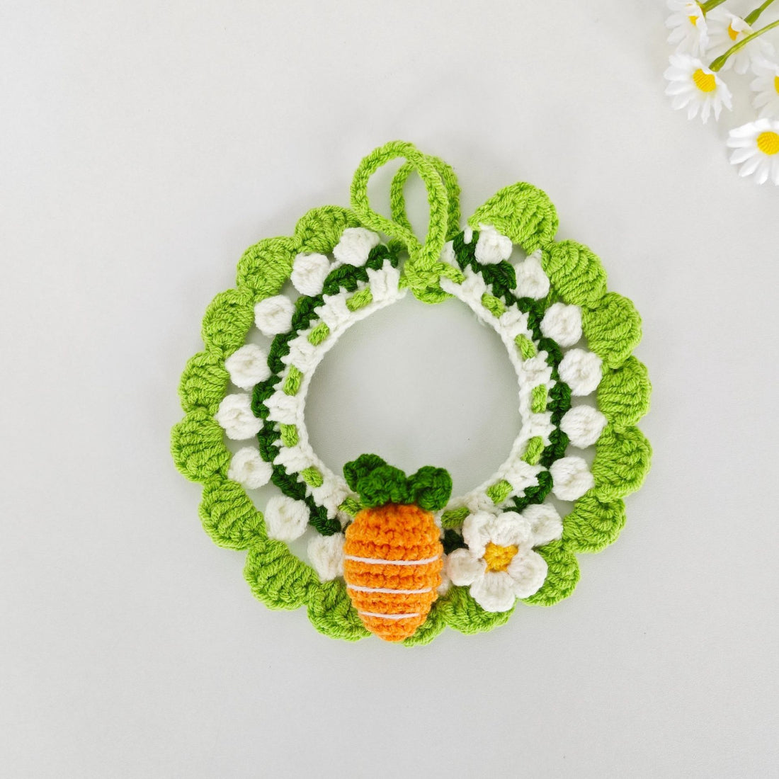 Mokka crochet carrot cat collar coiled with carrot charm and green leaves