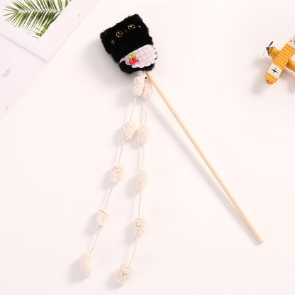 Cat playing with Moo plush cat teaser wand toy featuring vibrant feathers and plush elements