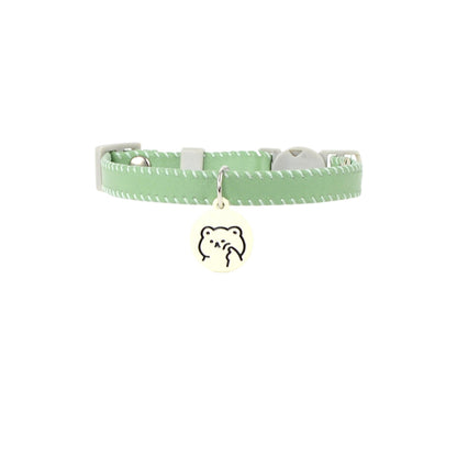 Mokka collar charm detached from collar, showing cartoon cat design and metal ring