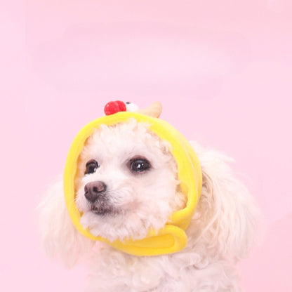 Yellow chick shape pet hat photographed from a side angle