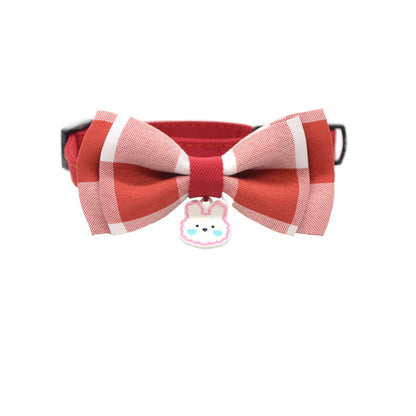 Close-up of silver bunny charm on pink breakaway cat collar