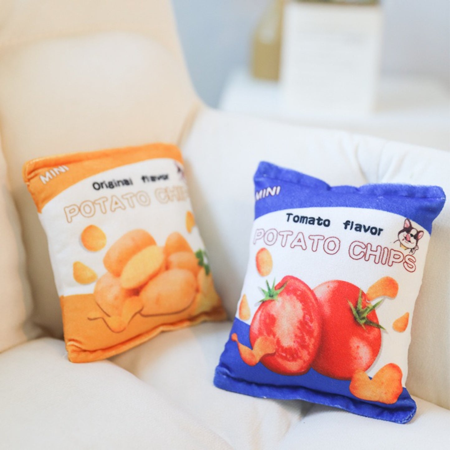 Petkin plush potato chips dog toy held in hand to show size and soft material
