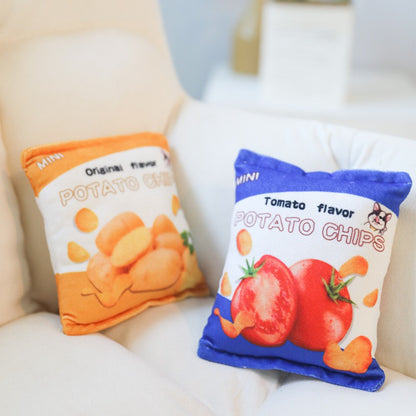 Petkin plush potato chips dog toy held in hand to show size and soft material