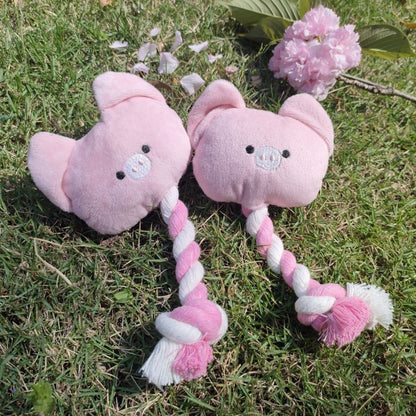 Pink pig-shaped rope dog toy with knotted ends for chewing and tugging