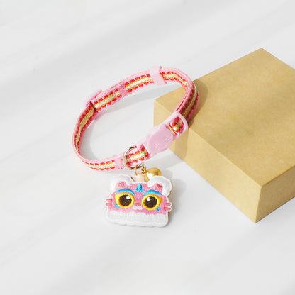 Side view of Mokka cat collar with tiger head charm on a smooth band