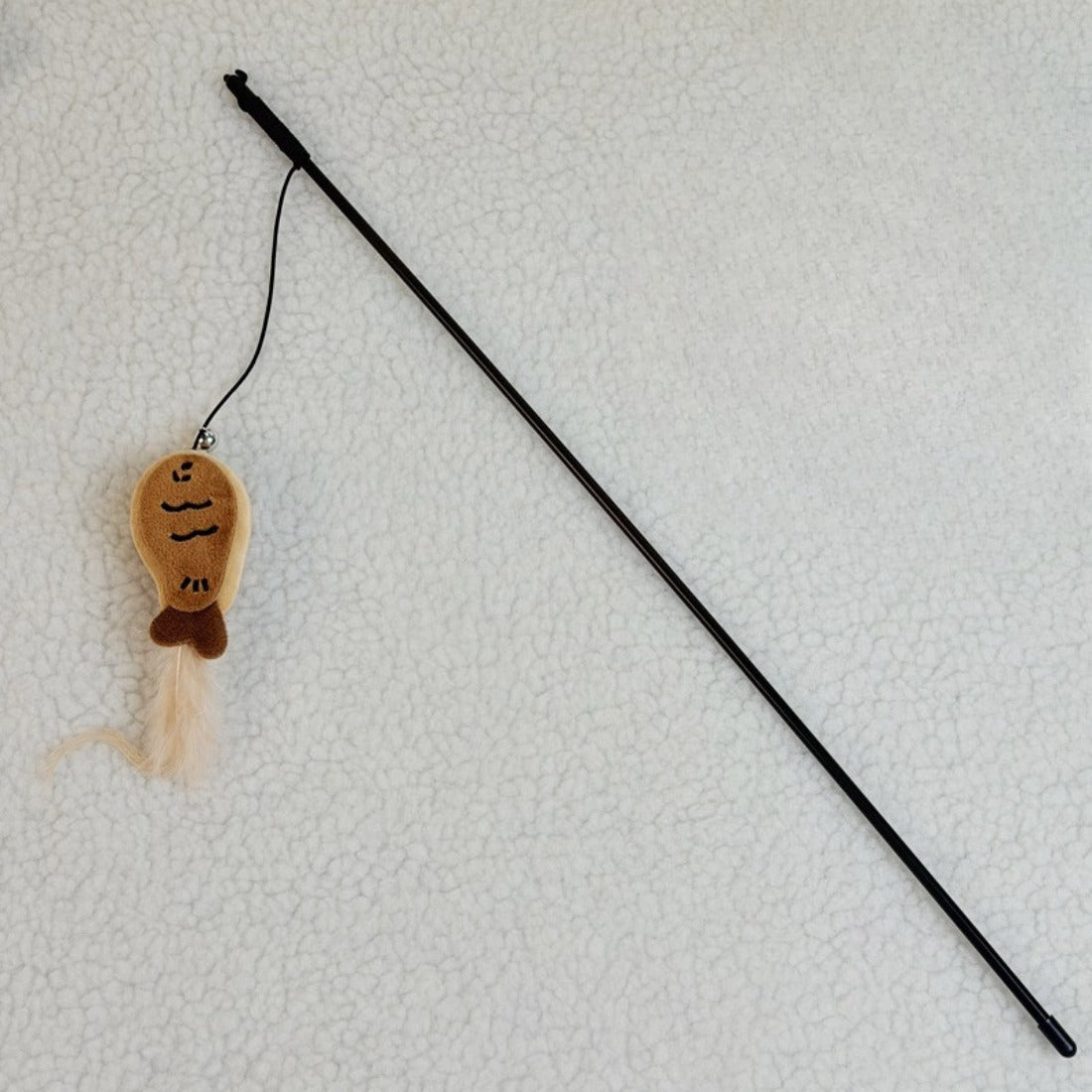 Full view of the Moo Cookie plush cat teaser wand with wooden handle and feather tip