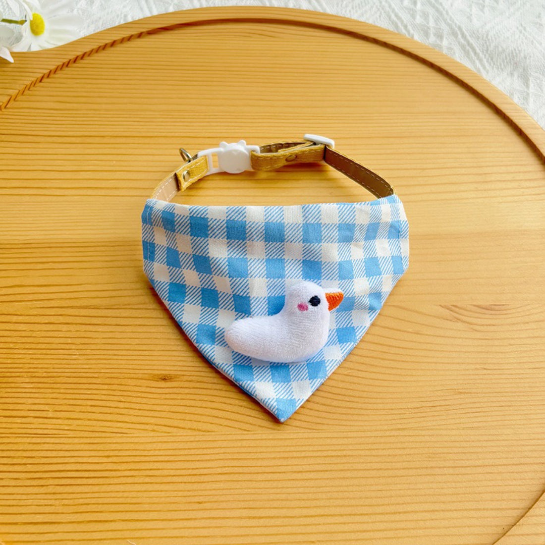 Side view of cat with Mokka blue gingham bandana