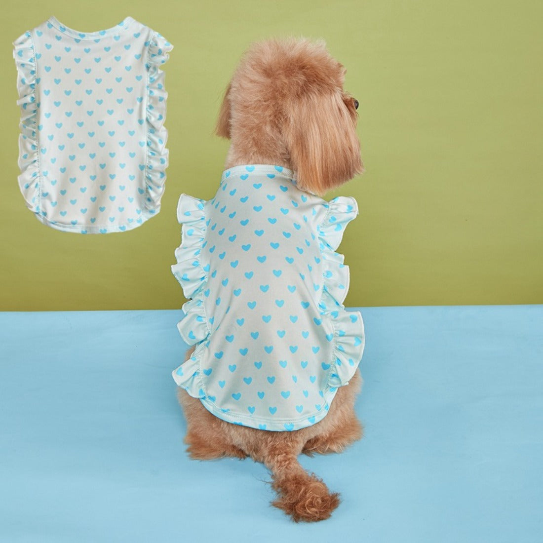 Close-up of ruffle detail on sleeve of white dog t-shirt with red heart print