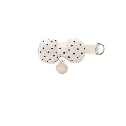 Close-up of Mokka polka dot bow tie attached to brown breakaway cat collar