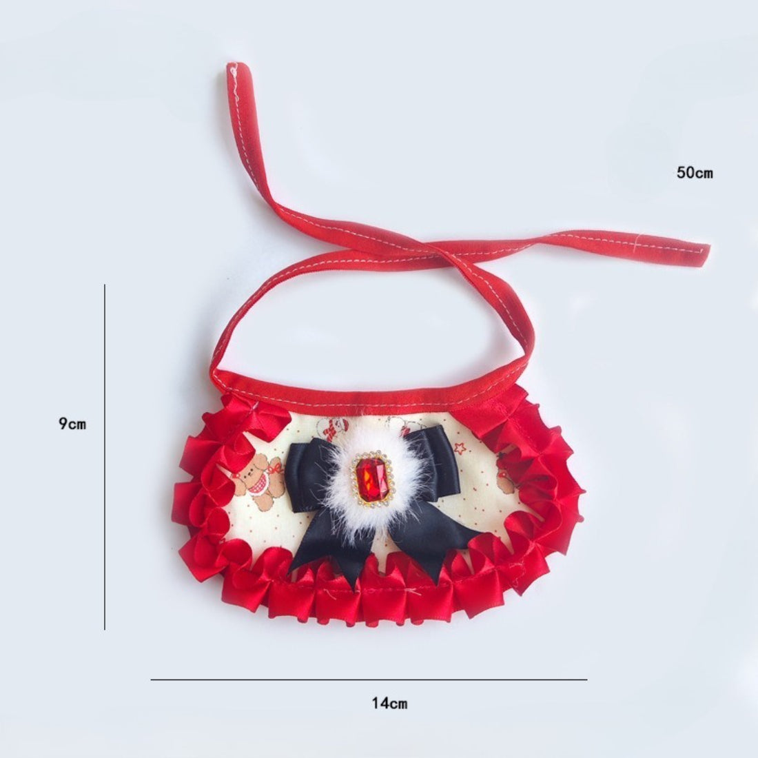 Mokka cat neck bib displayed flat highlighting the ruffled design and gem centerpiece