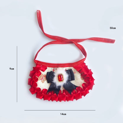 Mokka cat neck bib displayed flat highlighting the ruffled design and gem centerpiece