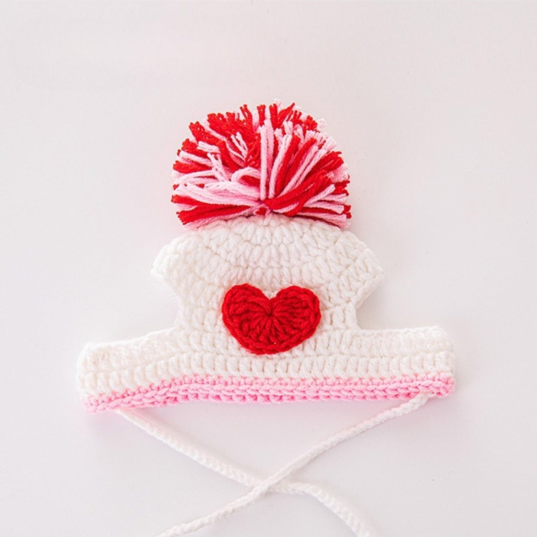 Ozzie Pom Pom Knit Cat Hat in cream color displayed on white background