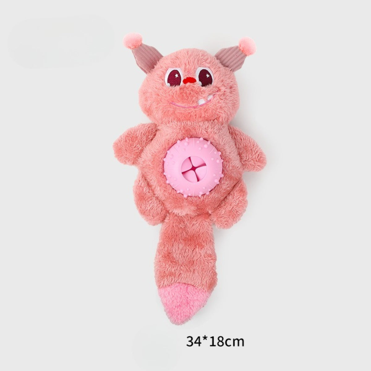 Side view of Petkin plush monster treat dispensing dog toy on white background