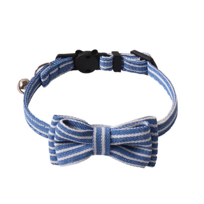 Mokka cat collar with stripe bow tie displayed coiled on surface