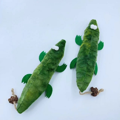 Two green Crocodile cat toys viewed from above, showing mottled backs, four flat legs and tail attachments