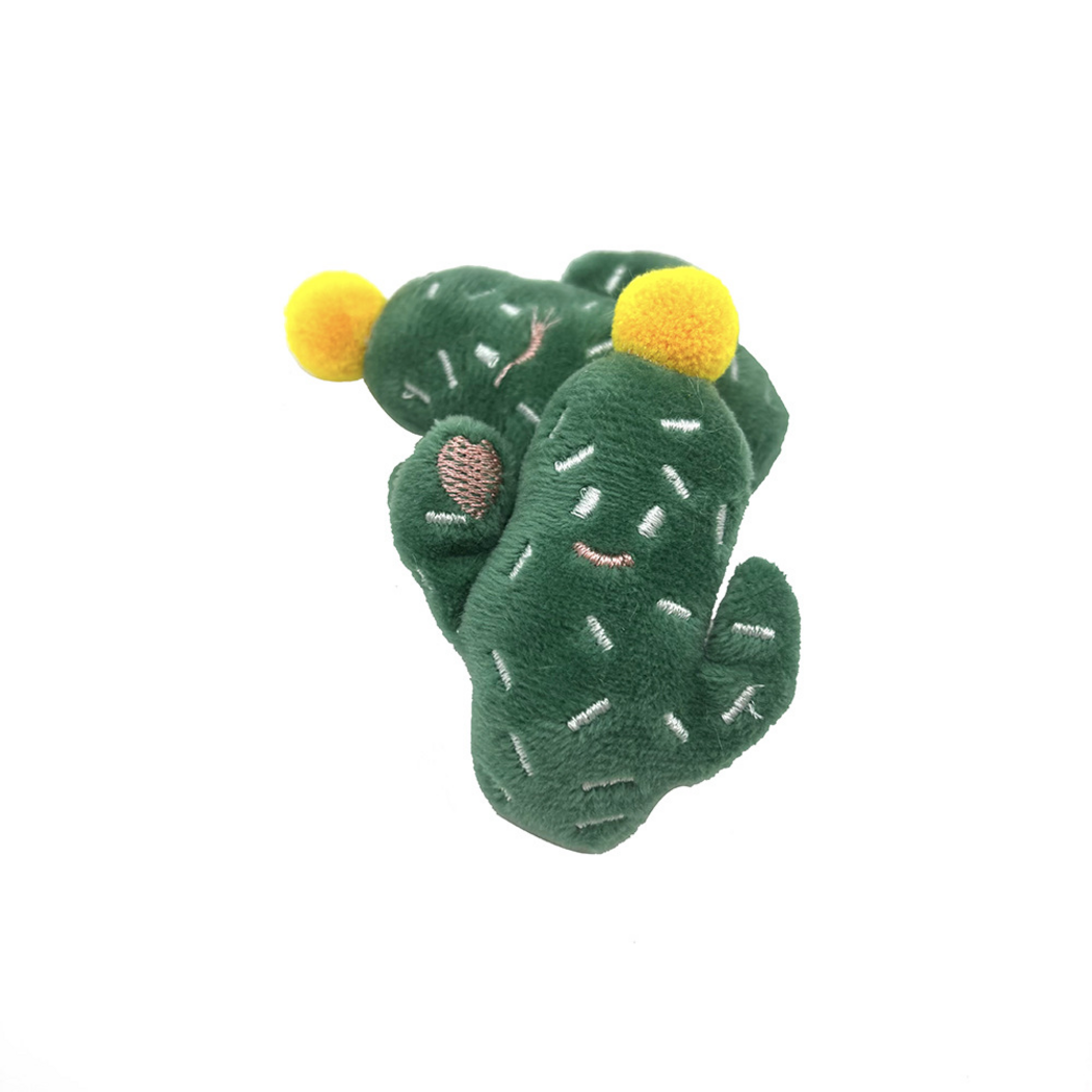 Green cactus-shaped cat toys with yellow top balls, white dash stitches and a pink arm patch
