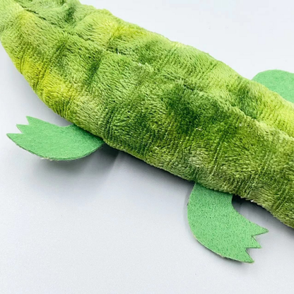Close-up of the Crocodile cat toy's mottled green surface, stitched body lines and flat pointed-toe legs