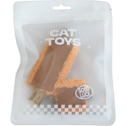 Orange cat toys visible inside a translucent pouch marked CAT TOYS and GOOD LUCK