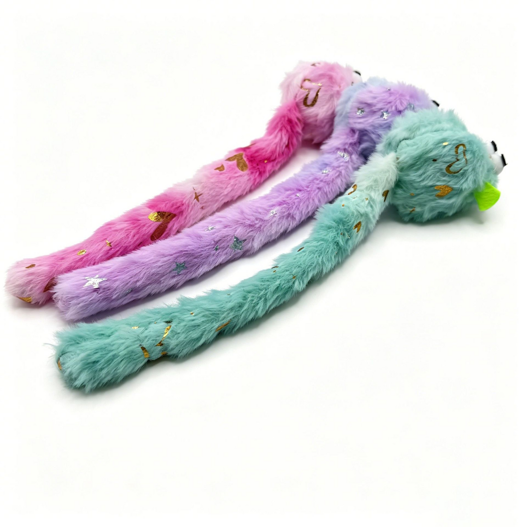 Rear angled view of three mouse-shaped cat toys with long patterned tails