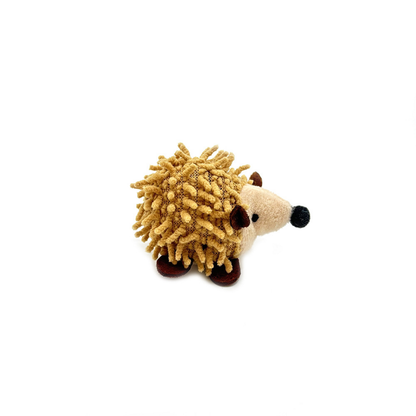 Hedgehog cat toy in side view, showing tan textured strands and brown feet