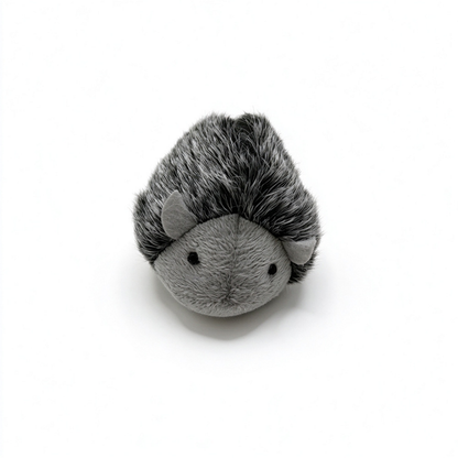 Hedgehog-shaped cat toy with a shaggy dark back and gray rounded face, front view
