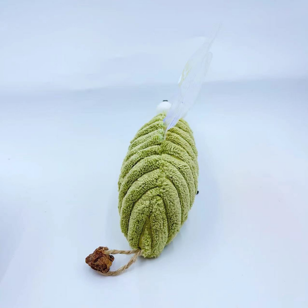 Rear view of the Mosquito cat toy showing its ribbed green body and brown cord attachment