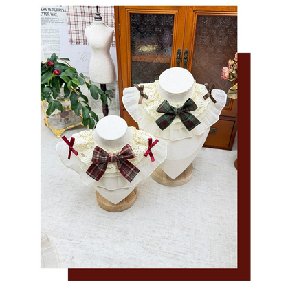 Burgundy and Teal Pet Neckwear displayed together with patterned bows and layered cream ruffles