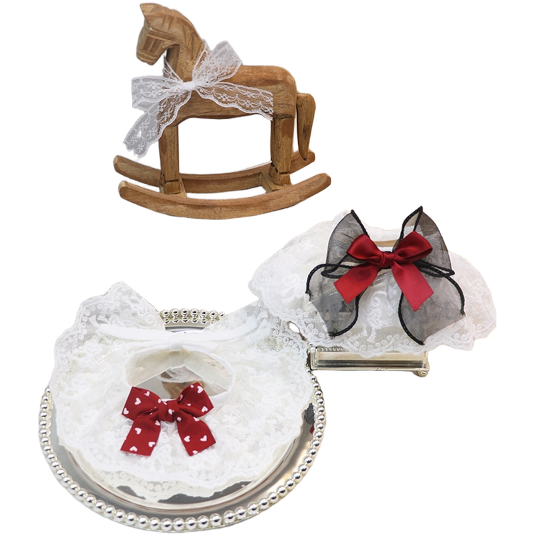 Burgundy and Black Pet Neckwear displayed together with heart-patterned and layered bows
