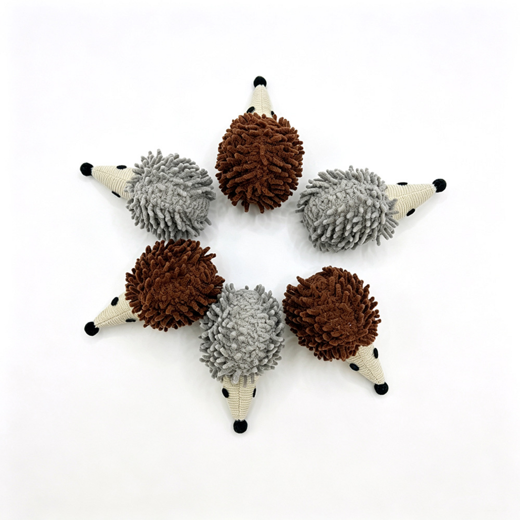 Gray and Brown hedgehog cat toys arranged radially with their snouts pointing outward