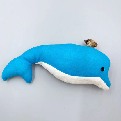 Dolphin cat toy with a blue body, white underside, black eye and brown cord-secured attachment, side view