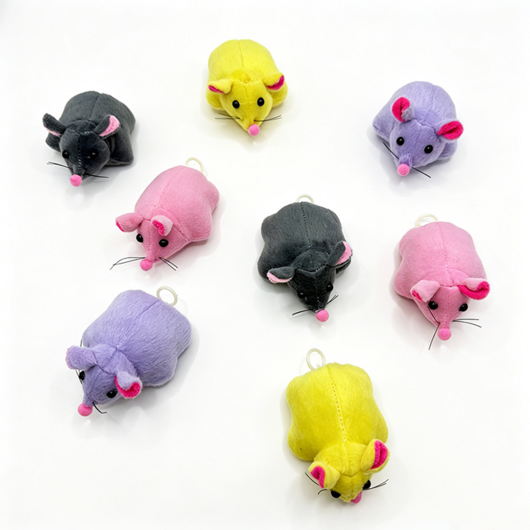 Gray, Pink, Yellow and Purple mouse cat toys viewed from above