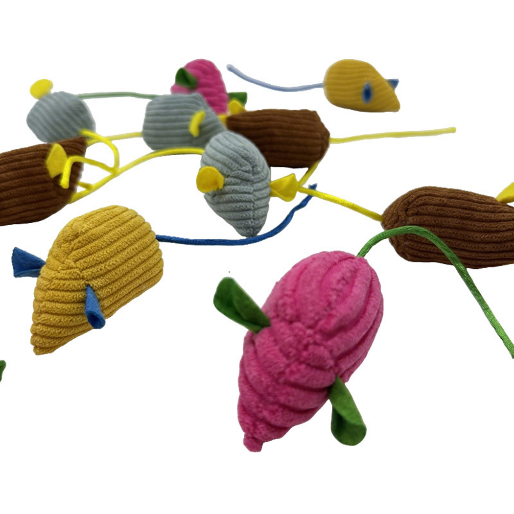 Close-up of ribbed mouse-shaped cat toy bodies, contrasting ears and cord tails