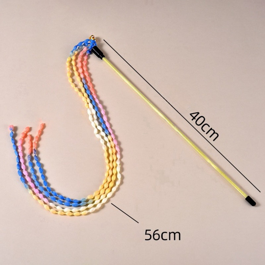 Moo cat teaser wand laid flat showing full length of braided cord and attached teaser string