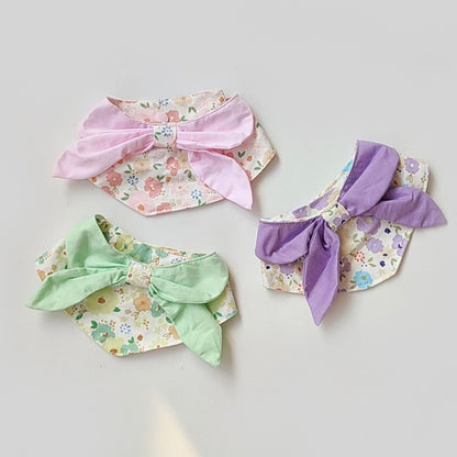 Mokka flower print cat neck bib displayed flat showing floral pattern