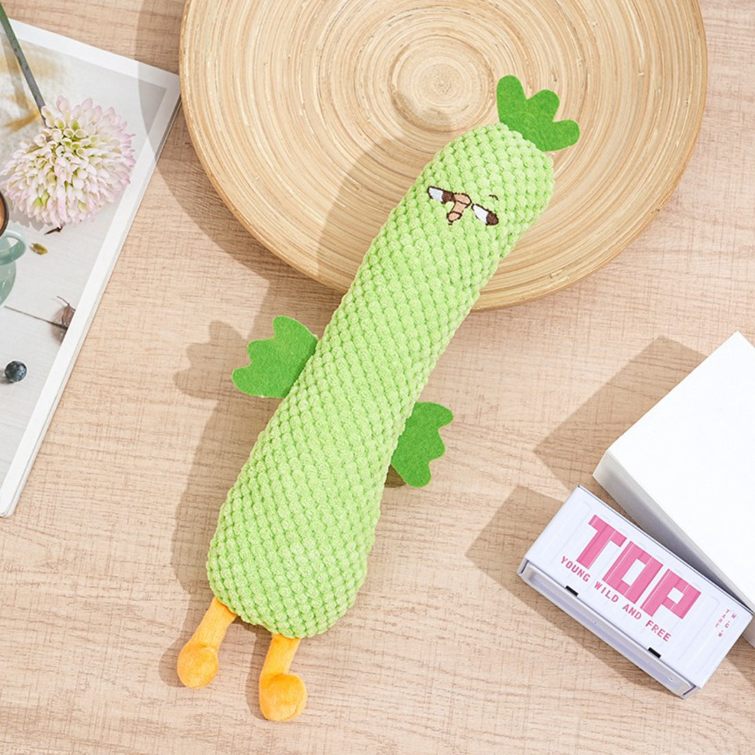 Petkin plush dog toy held in hand to show size suitable for small dogs
