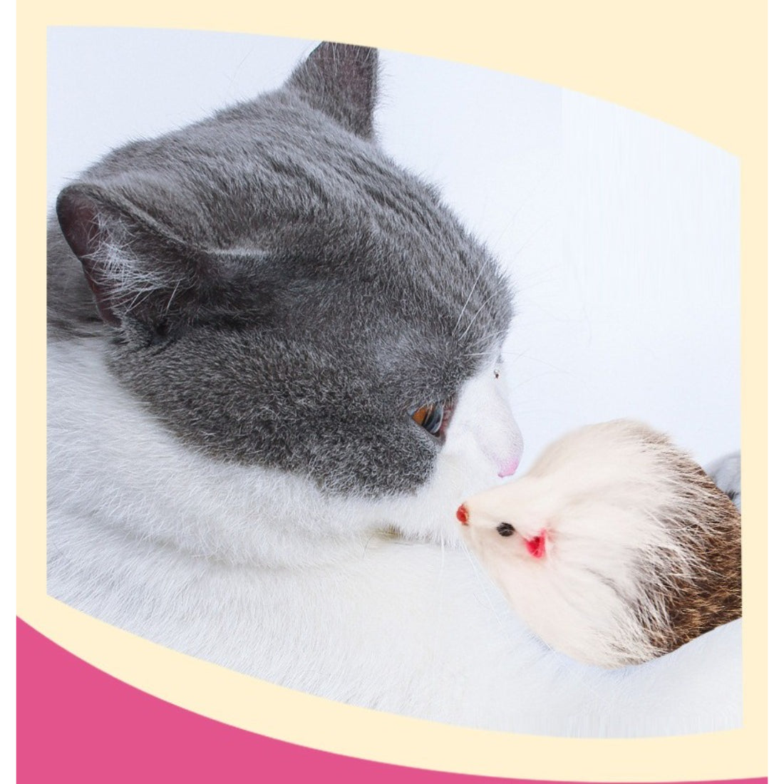 Moo faux fur mouse cat toy displayed next to a cat paw for size comparison