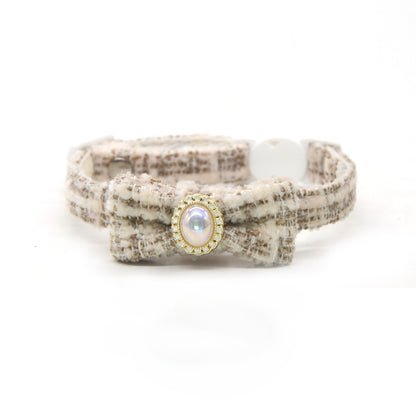 Mokka tweed bead bow cat collar worn by a cat