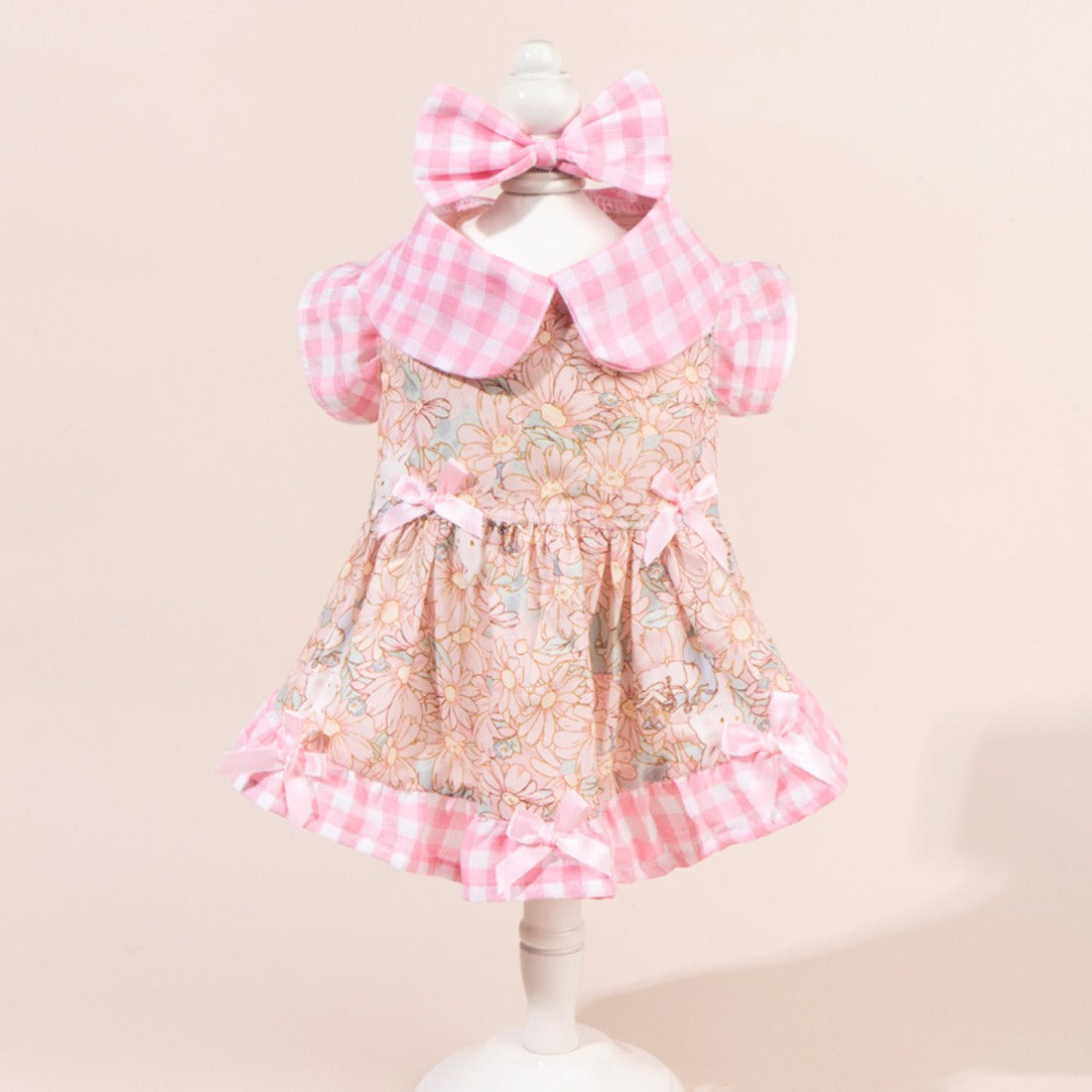 Side view of dog in Ozzie floral dress showing bow and ruffled skirt